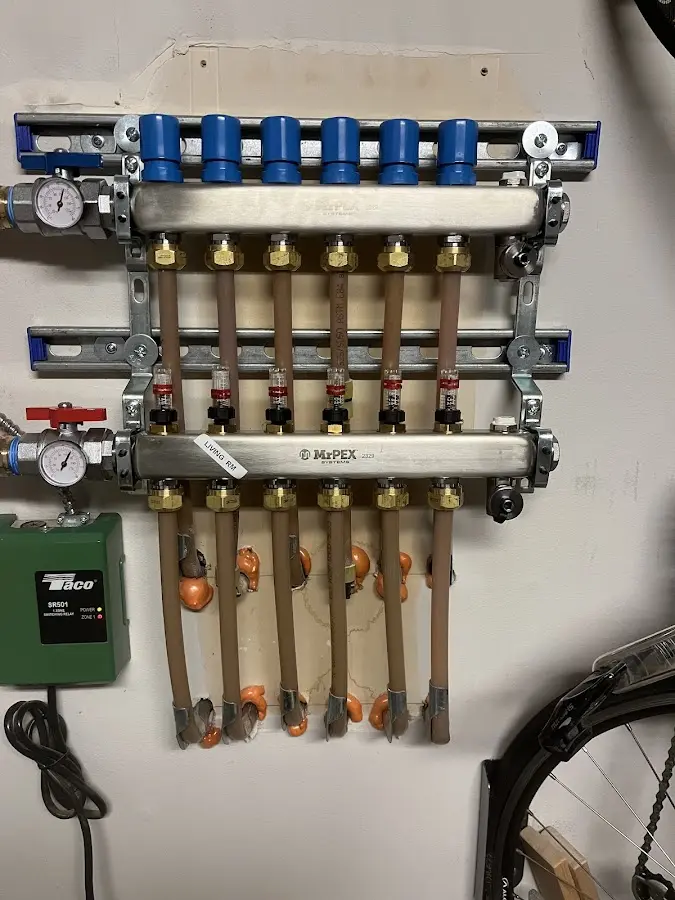 Plumber performing Water Heater Repair at a residential property in Rosenberg